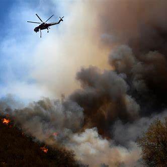 Flames Rip Through Homes as 30,000 Ordered to Flee Los Angeles Wildfire