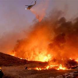 As Winds Pick Up, LA Firefighters Battle to Contain Monster Inferno